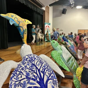All turtles, dolphin, oyster, and deer finished and on display on the stage.